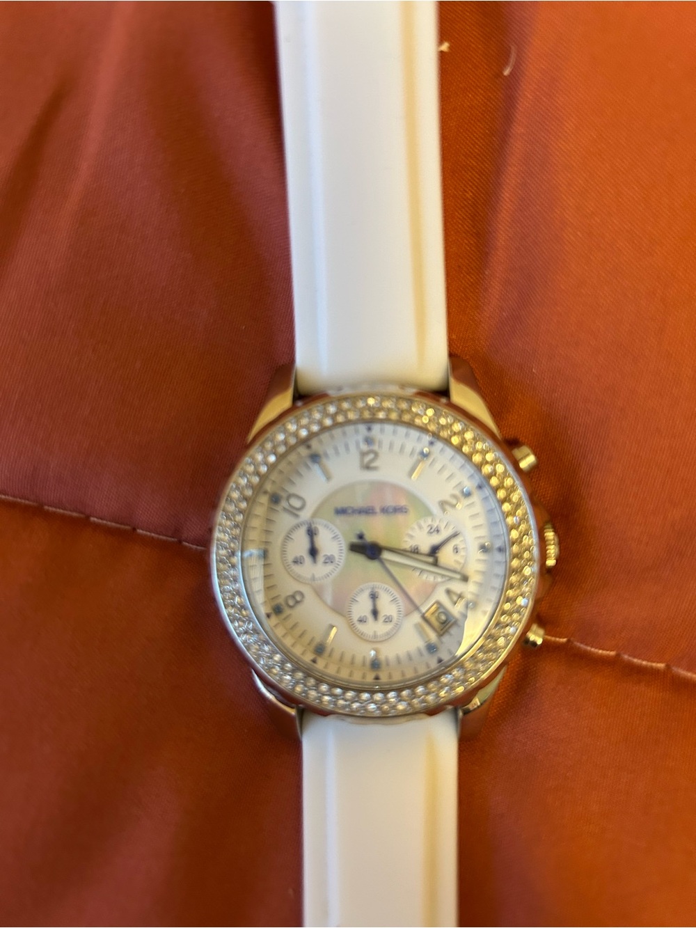 Wristwatch on white strap